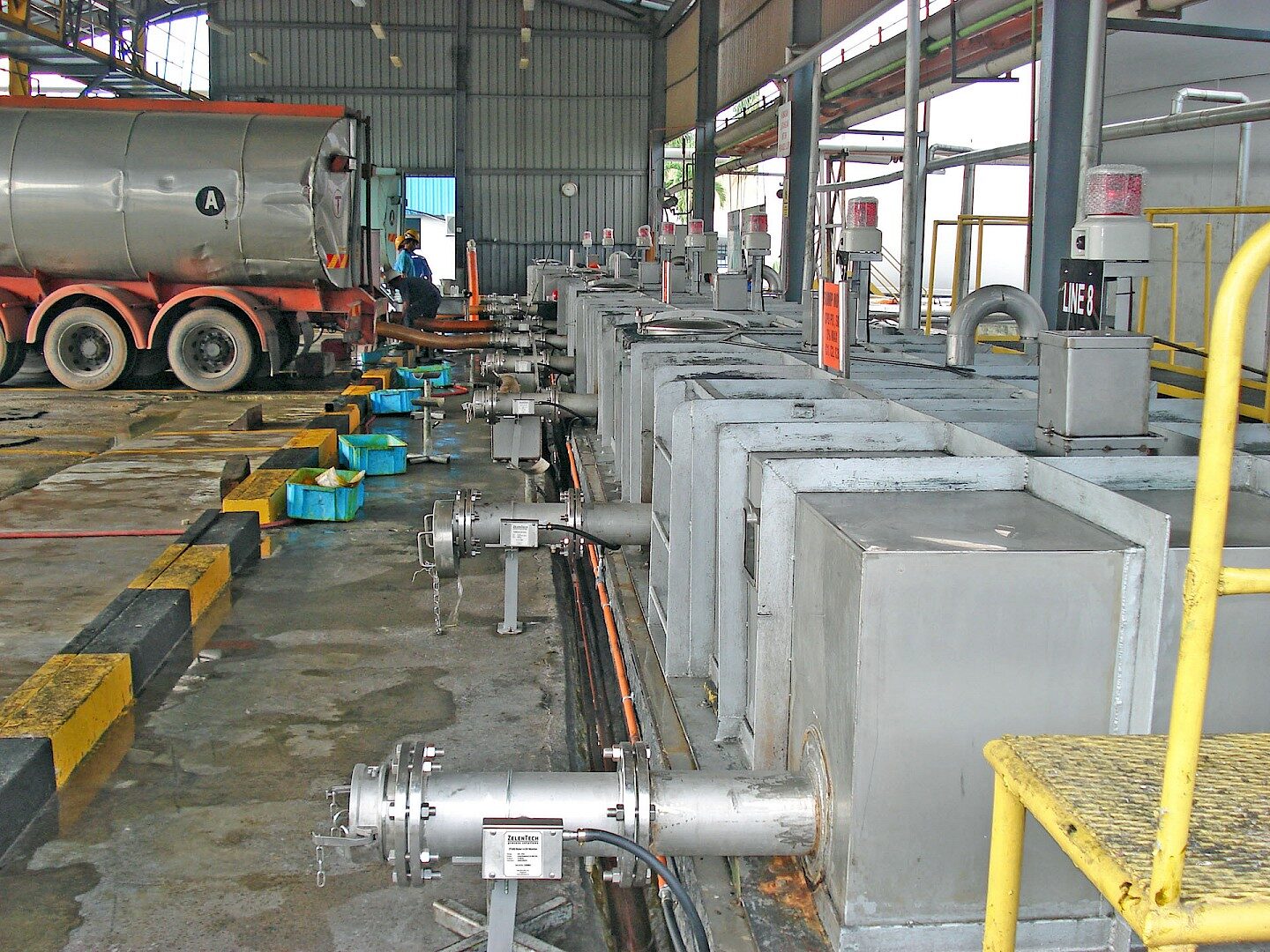 CPO tanker truck off-loading at a palm oil refinery intake